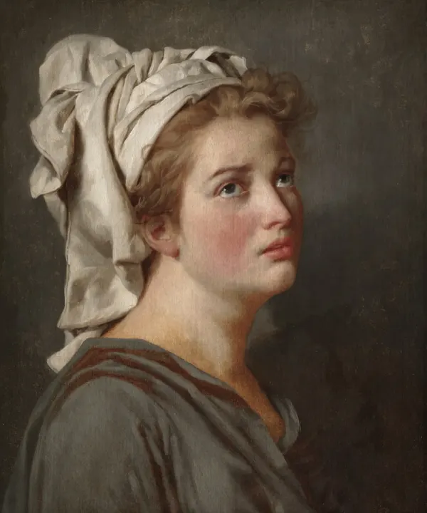 A portrait of a young woman in a white headscarf